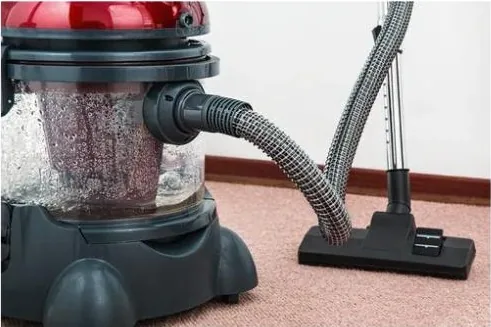 Deep cleaning an empty room for move-out